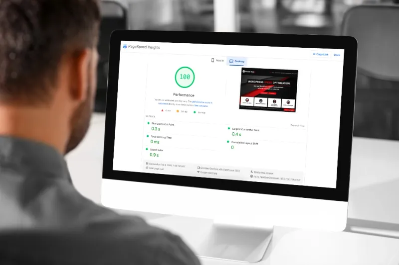 PageSpeed Insights showing a score of 100 on a desktop monitor